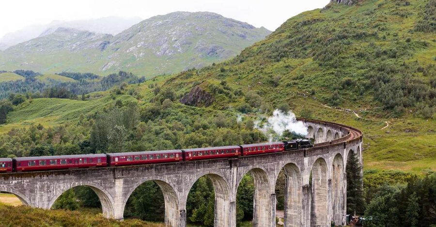 From Edinburgh: Hogwarts Express and Scottish Highlands Tour - Leaving Edinburgh beside the Forth Bridge