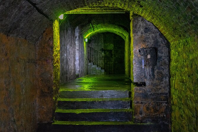 Haunted Vaults and Graveyard Walking Tour in Edinburgh - Greyfriars Kirk and its graveyard after dark